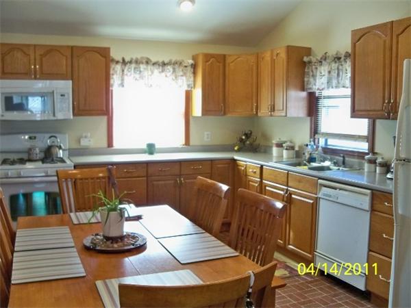 177 Palmer Road Monson, MA 01057 - Photo 12 of 28 a kitchen with a sink and a stove top oven