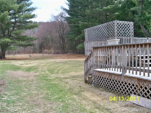 177 Palmer Road Monson, MA 01057 - Photo 5 of 28 a view of a deck with a fence
