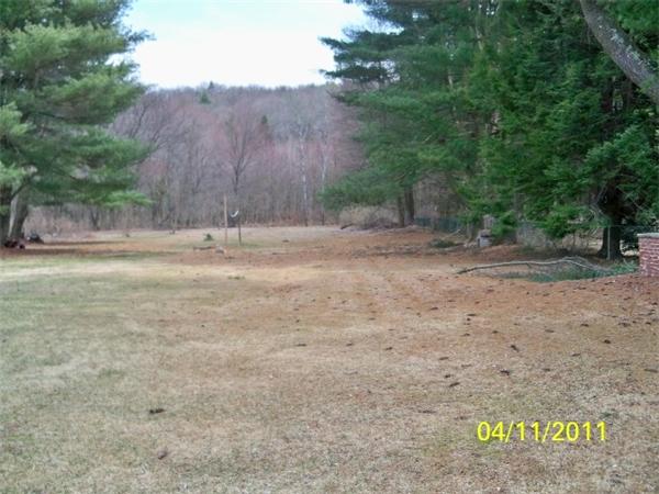 177 Palmer Road Monson, MA 01057 - Photo 6 of 28 a view of a dry yard with trees