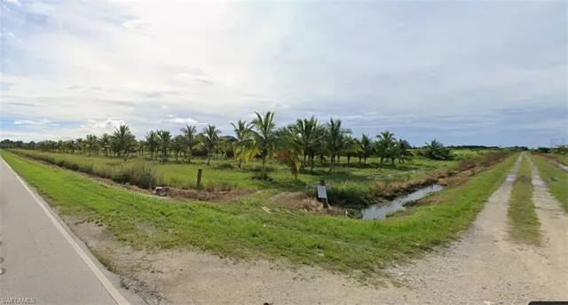 a view of a lake with green space