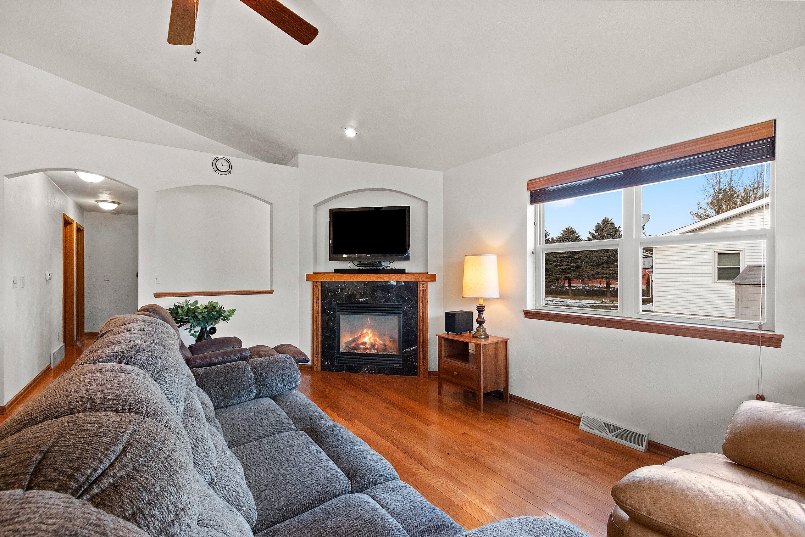 3006 South 19th Street Manitowoc, WI 54220 - Photo 13 of 38 living area with gas fireplace