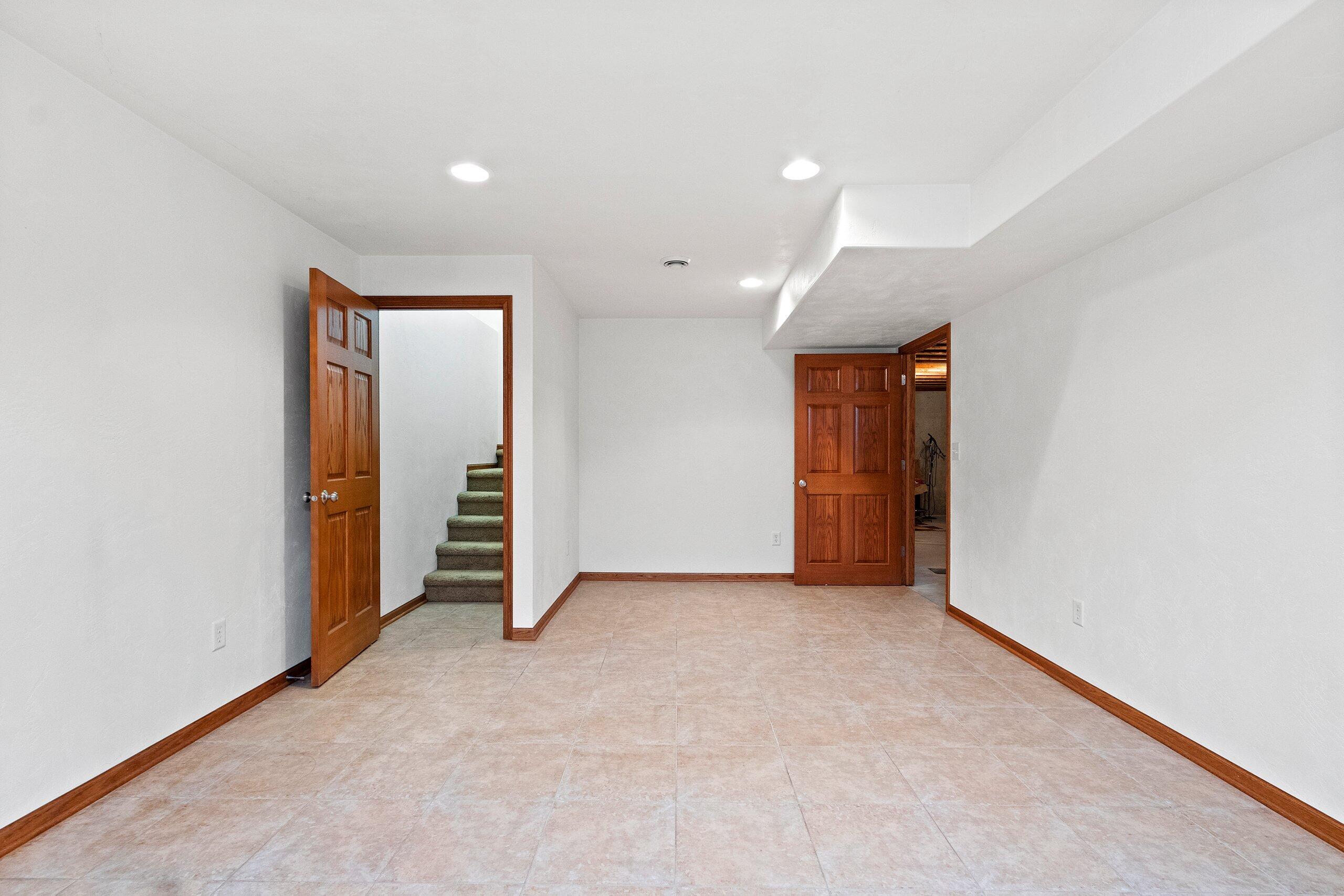 3006 South 19th Street Manitowoc, WI 54220 - Photo 27 of 38 downstairs family room or could with egress window