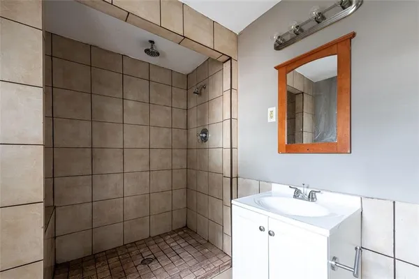 a bathroom with a sink and mirror