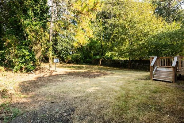 a view of a yard with a tree