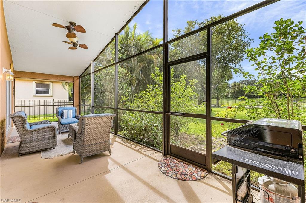 1415 Princess Sabal Point Naples, FL 34119 - Photo 22 of 42 Screened patio featuring a solid concrete floor and multiple ceiling fans