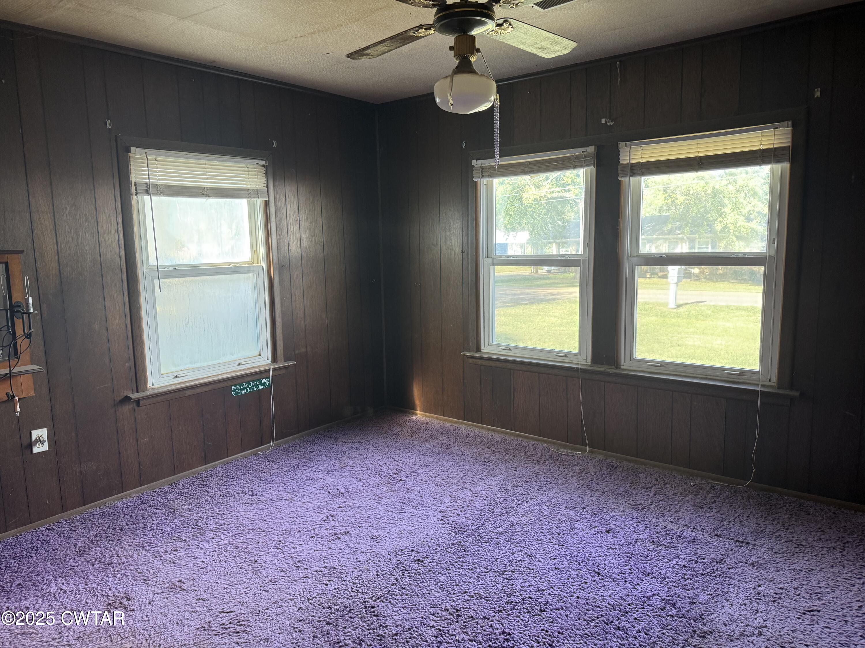 402 Harts Bridge Road Jackson, TN 38301 - Photo 6 of 15 an empty room with a window and a fan