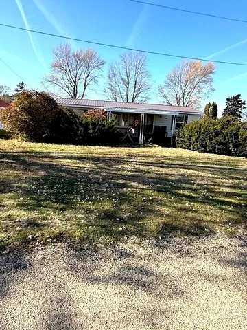 a view of a house with a ocean beach