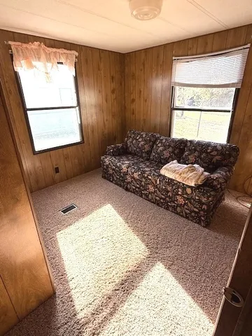 a bathroom with a tub sink and window
