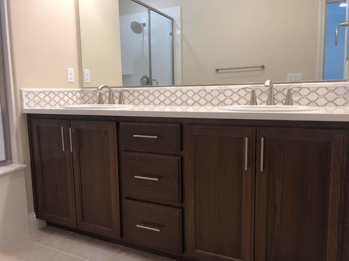 263 Wild Rose Way Milpitas, CA 95035 - Photo 16 of 30 a bathroom with a granite countertop sink and a mirror