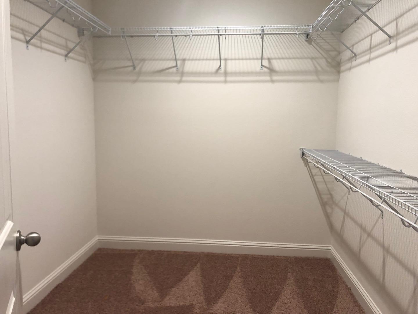 263 Wild Rose Way Milpitas, CA 95035 - Photo 17 of 30 a view of a room with racks on the wall