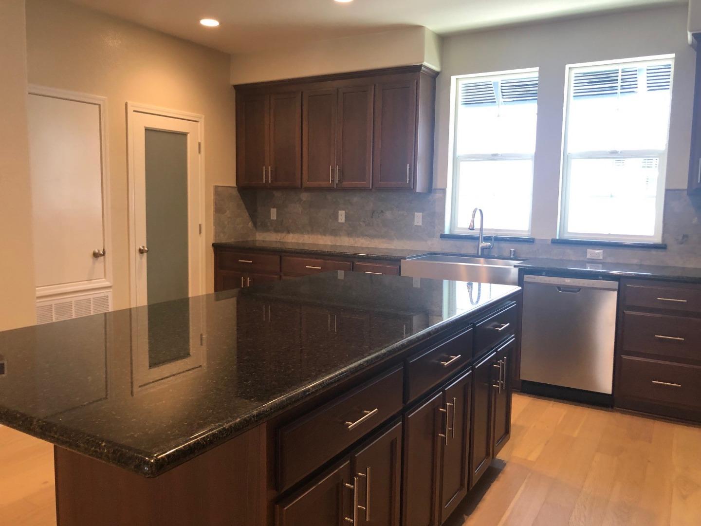 263 Wild Rose Way Milpitas, CA 95035 - Photo 9 of 30 a kitchen with stainless steel appliances granite countertop a sink stove and refrigerator