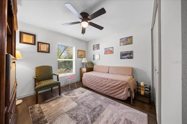 a bedroom with a bed and a couch