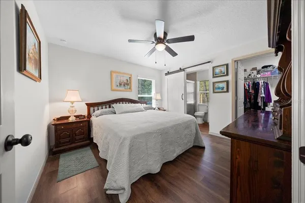 a bed room with a bed and a flat screen tv