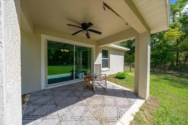 a view of a porch with backyard and garden