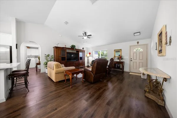 a living room with furniture window and wooden floor