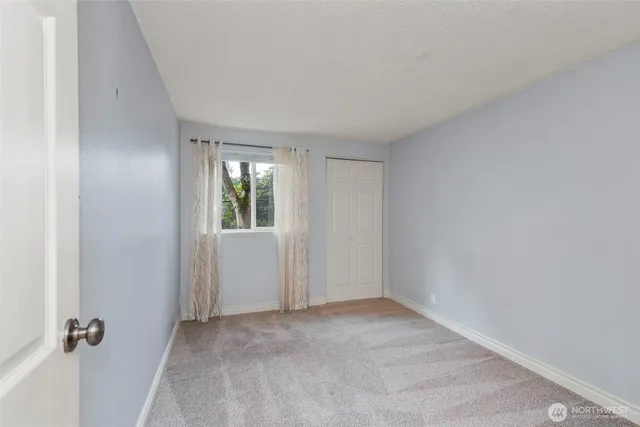 a bathroom with a granite countertop toilet a sink and a shower