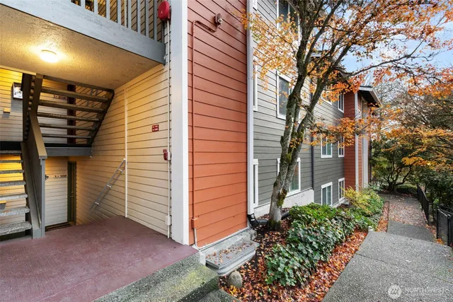 a pathway of a house with a yard