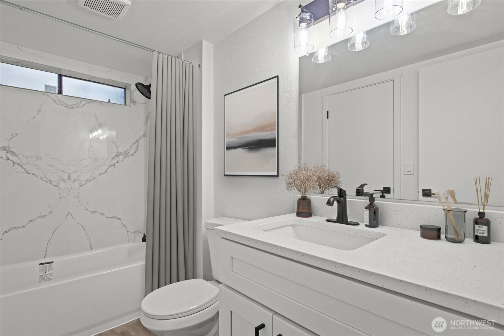 138 Southwest 116th Street, Unit G15 Seattle, WA 98146 - Photo 14 of 21 a bathroom with a sink a toilet and shower