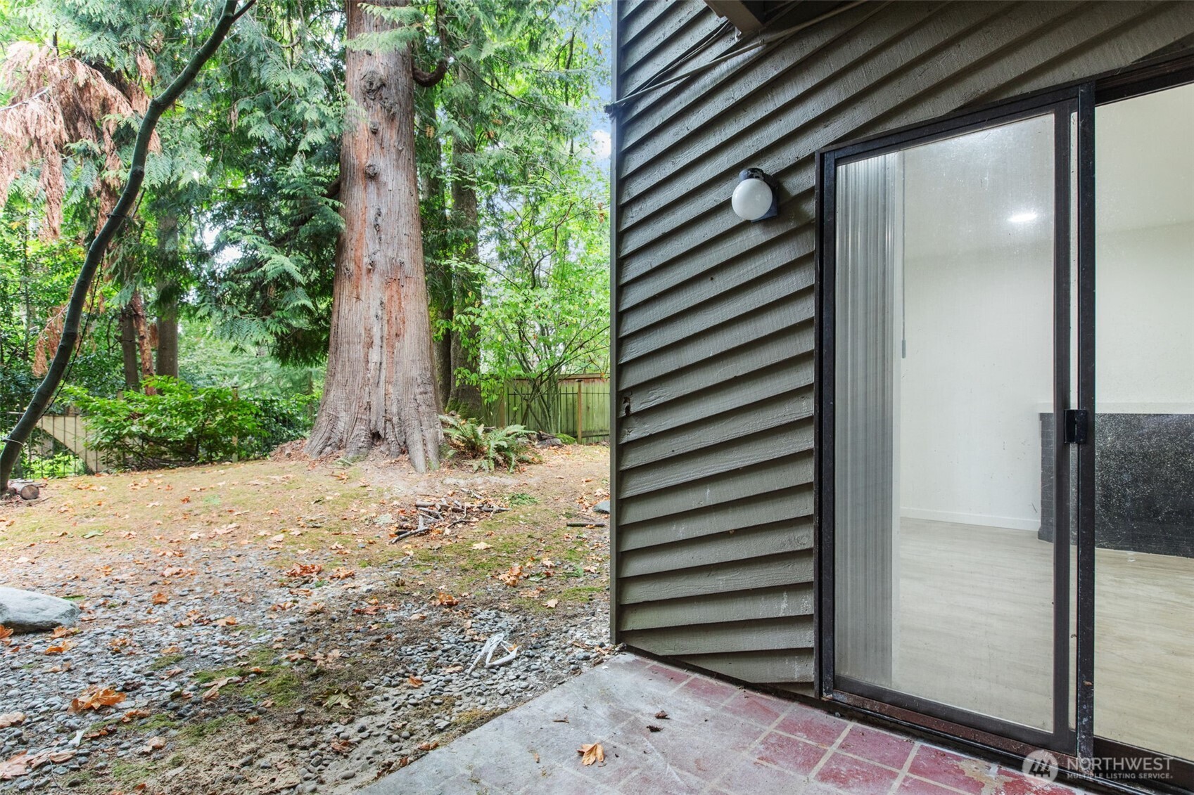 138 Southwest 116th Street, Unit G15 Seattle, WA 98146 - Photo 19 of 21 a view of a back yard from a hallway