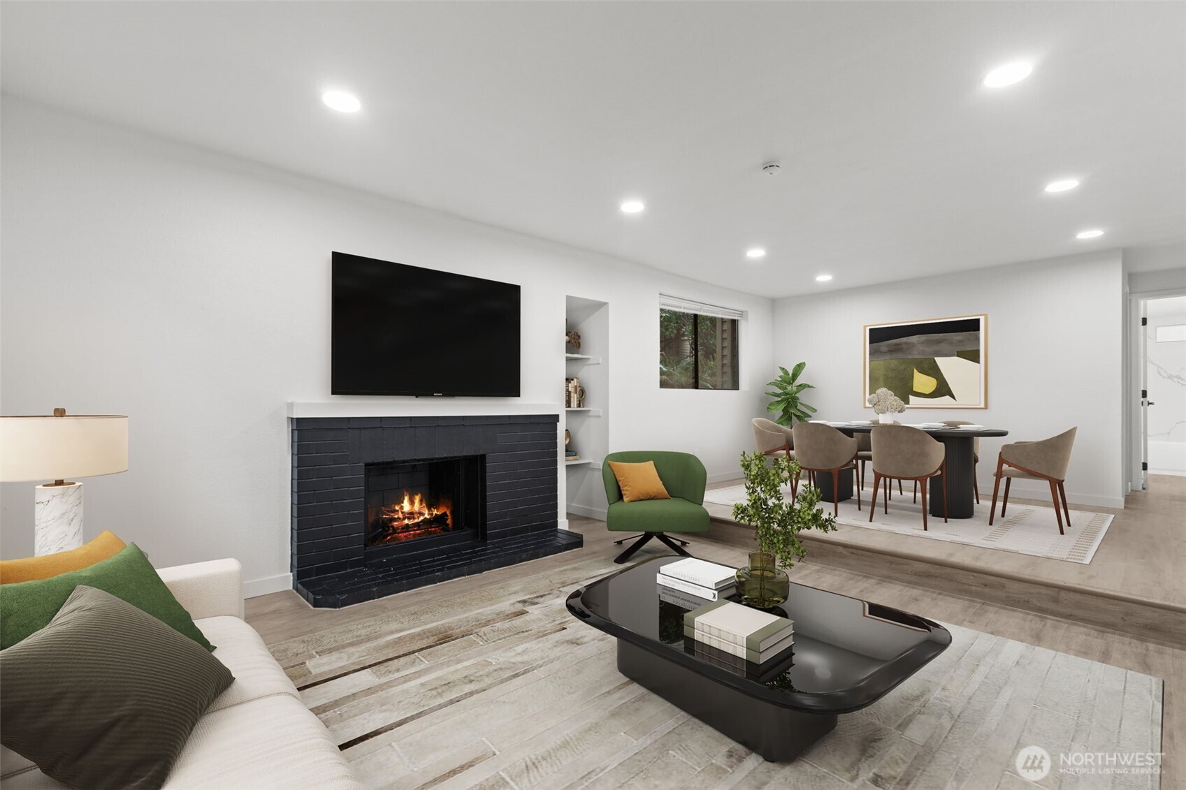 138 Southwest 116th Street, Unit G15 Seattle, WA 98146 - Photo 2 of 21 a living room with furniture and a fireplace