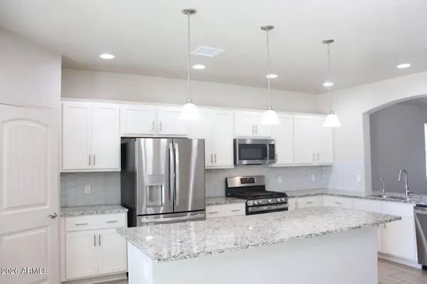 a large kitchen with cabinets
