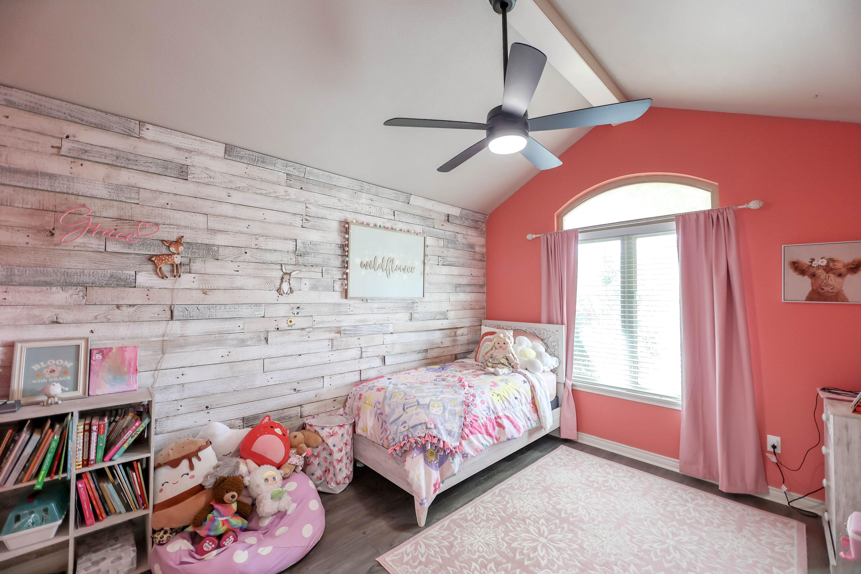 6008 103rd Street Lubbock, TX 79424 - Photo 17 of 29 a bedroom with a bed and a book shelf