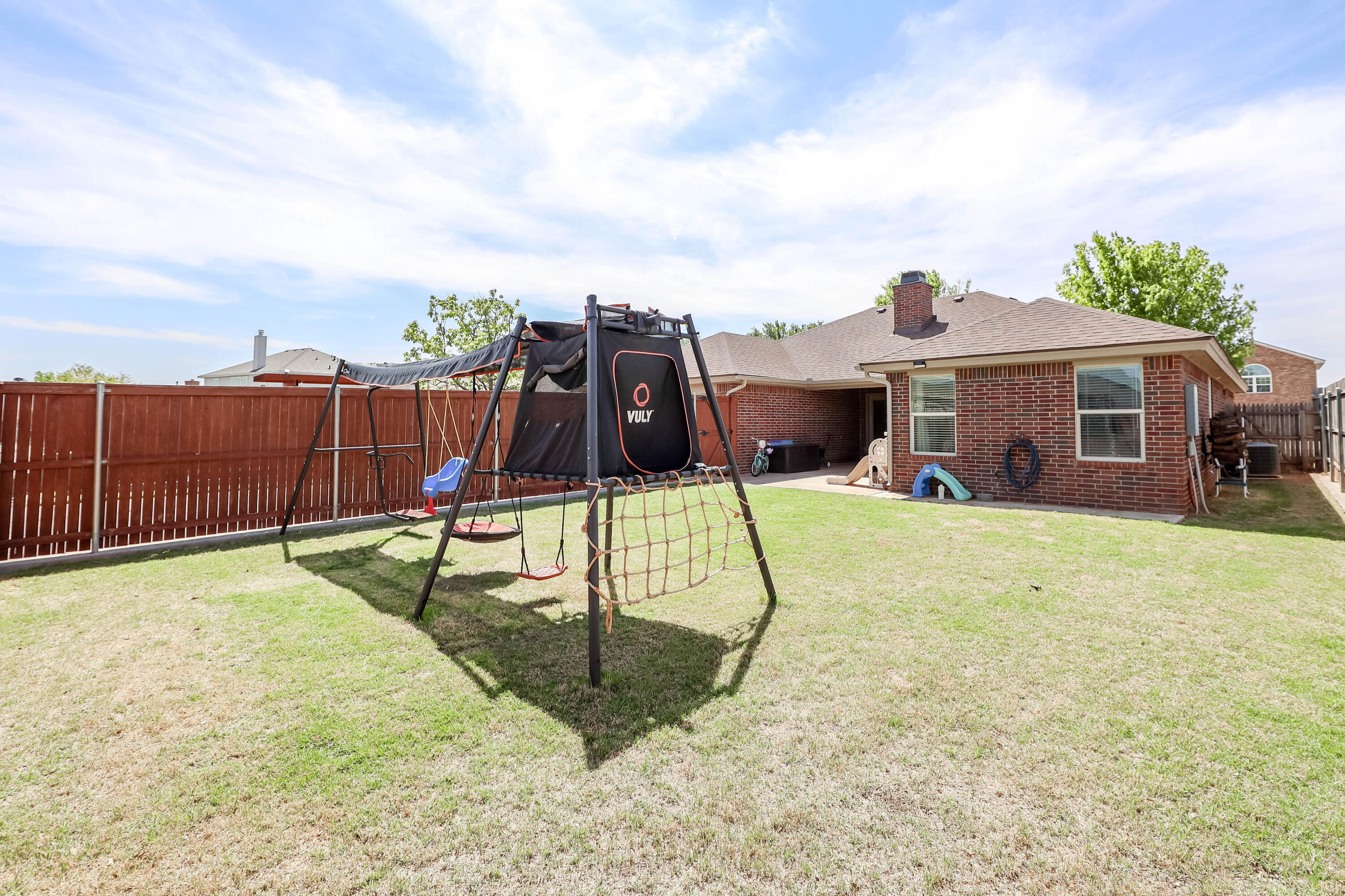 6008 103rd Street Lubbock, TX 79424 - Photo 29 of 29 a view of a house with a backyard