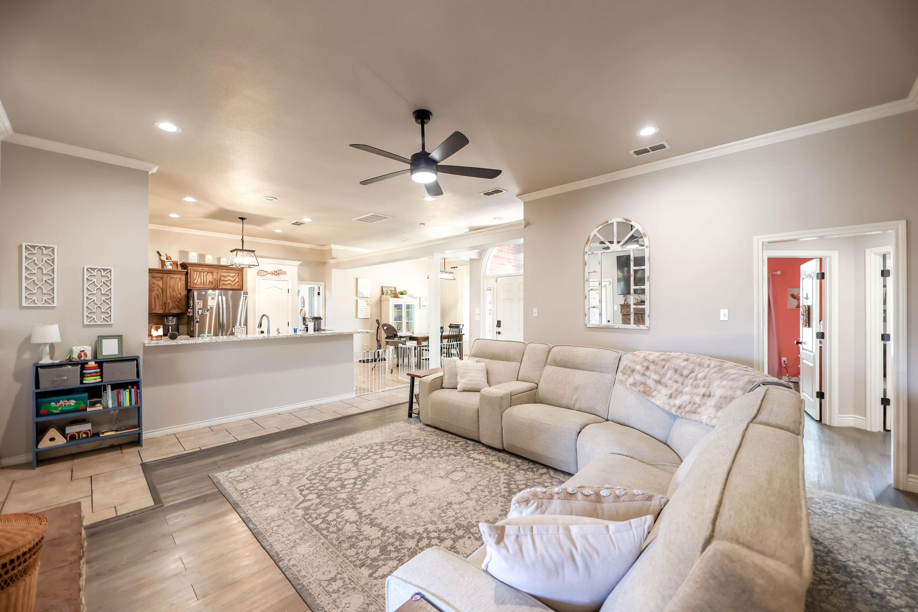 6008 103rd Street Lubbock, TX 79424 - Photo 5 of 29 a living room with furniture and a rug