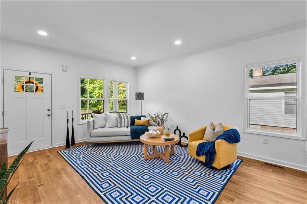 1622 Rankin Road Greensboro, NC 27405 - Photo 2 of 23 A bright, open living room area welcomes guests and provides room for gathering.