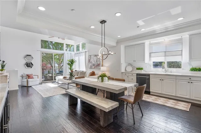 a living room with furniture a wooden floor and a window