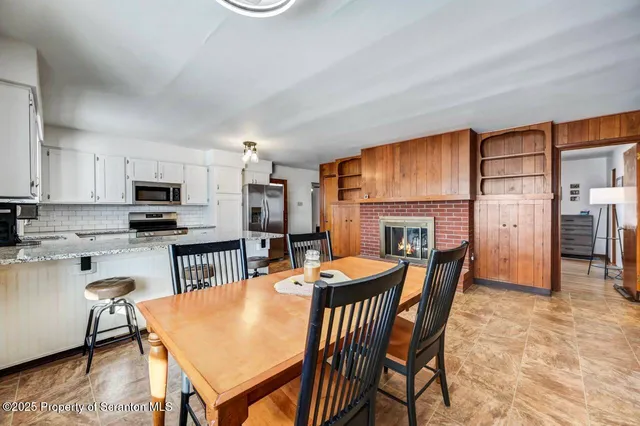 a view of a dining room with furniture window and outside view