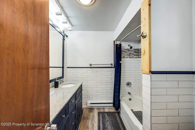 a bedroom with a bed and a workspace