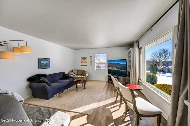a view of a dining room with furniture