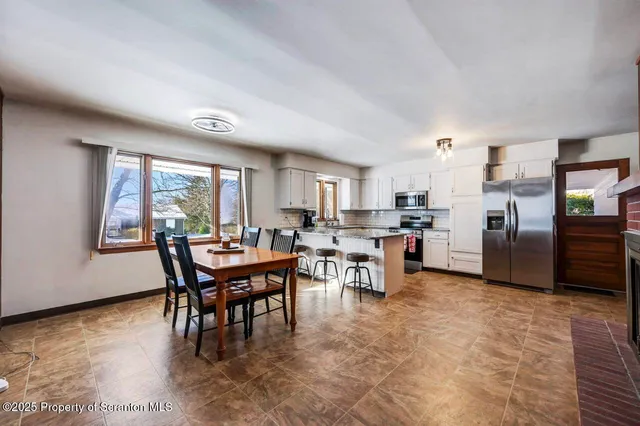 a view of a kitchen with furniture and a kitchen