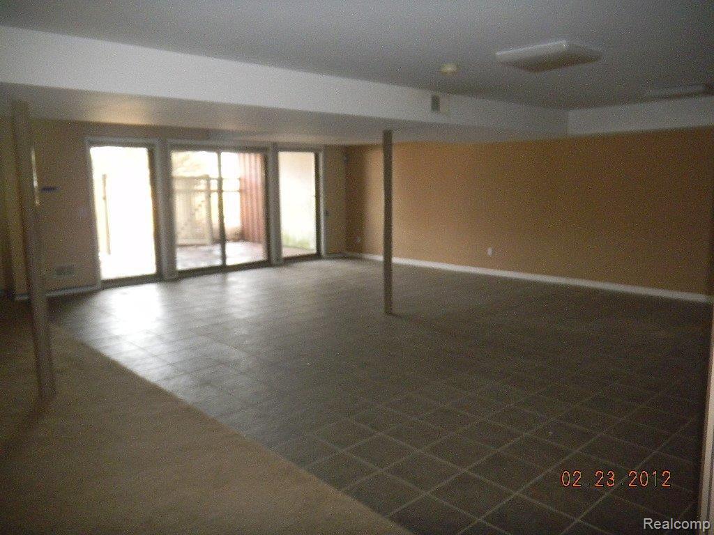 39930 Willis Road Belleville, MI 48111 - Photo 21 of 25 FINISHED WALK-OUT BASEMENT