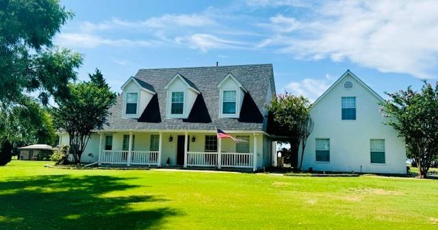 732 Equestrian Drive Rockwall, TX 75032 - Photo 1 of 30 a view of a white house with a big yard and potted plants and large trees