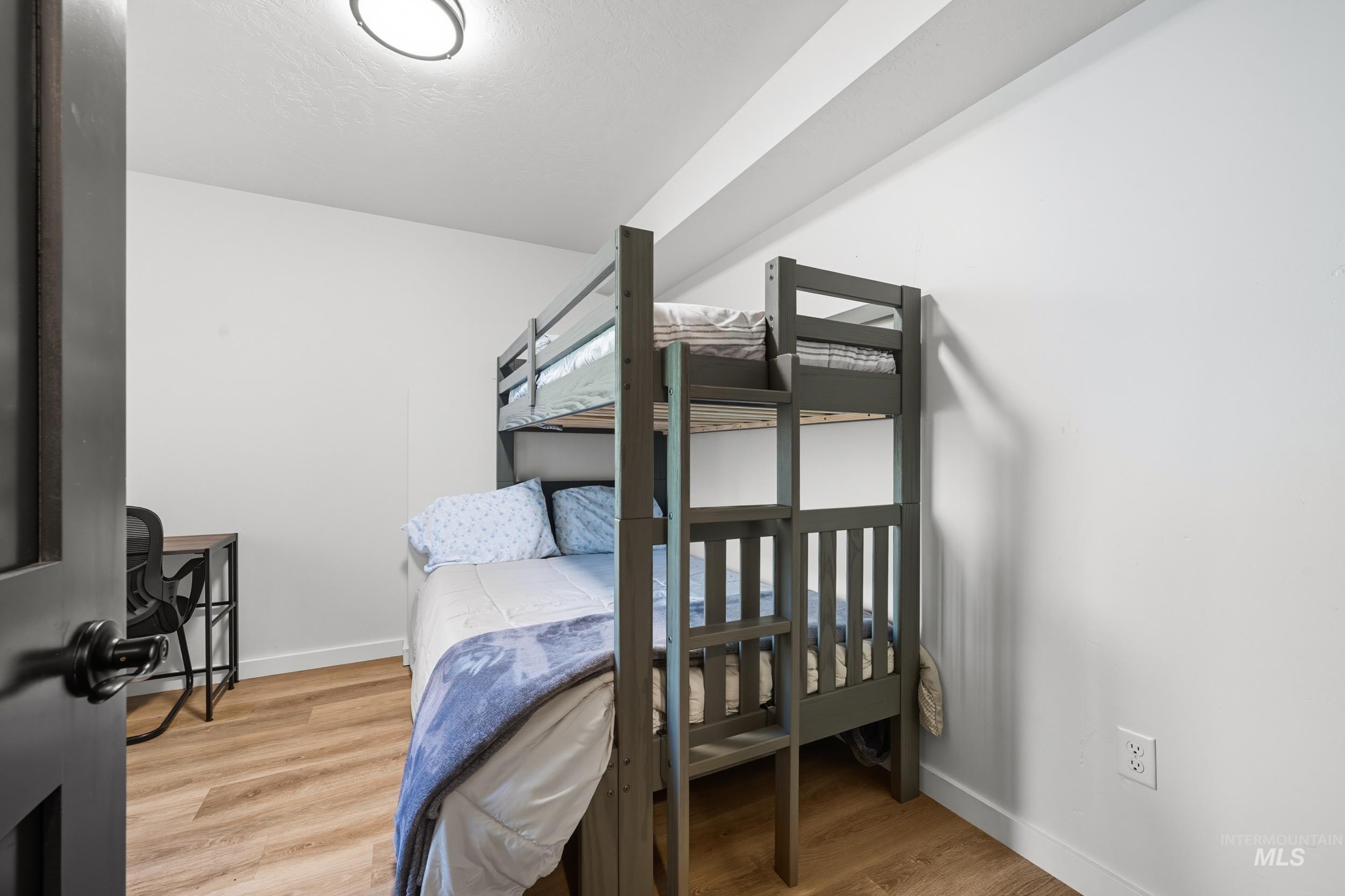 24 Rainbow Ridge Road Garden Valley, ID 83622 - Photo 19 of 32 Bedroom with baseboards and light wood-style flooring