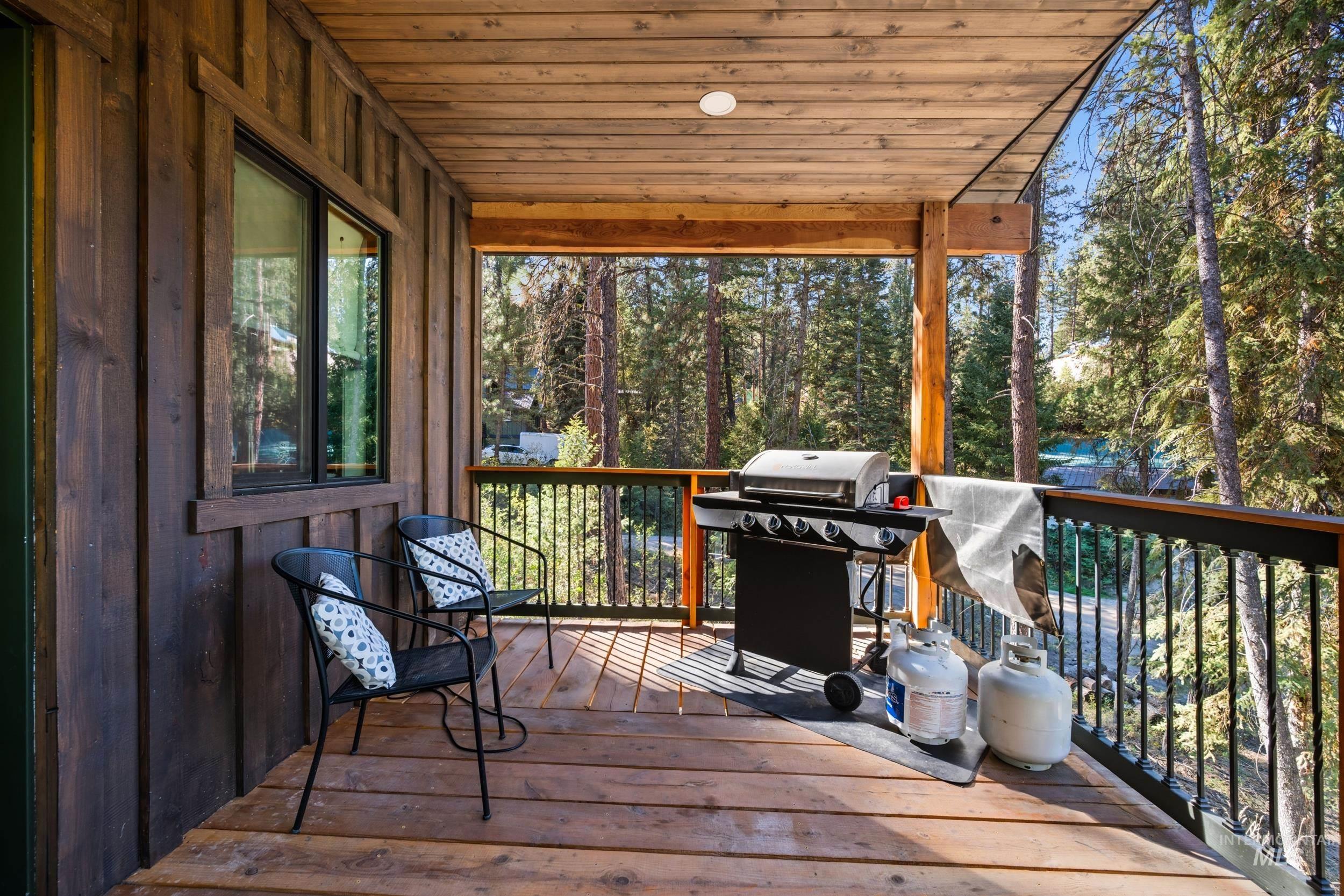 24 Rainbow Ridge Road Garden Valley, ID 83622 - Photo 24 of 32 Deck with area for grilling and view of scattered trees