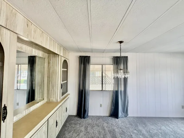 a view of an entryway with a kitchen