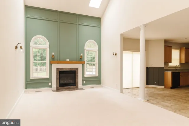 a kitchen with stainless steel appliances granite countertop a stove top oven a sink a counter space and cabinets