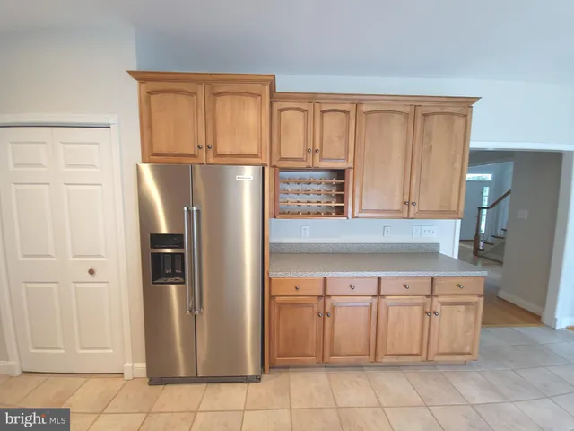 a kitchen with granite countertop a stove top oven