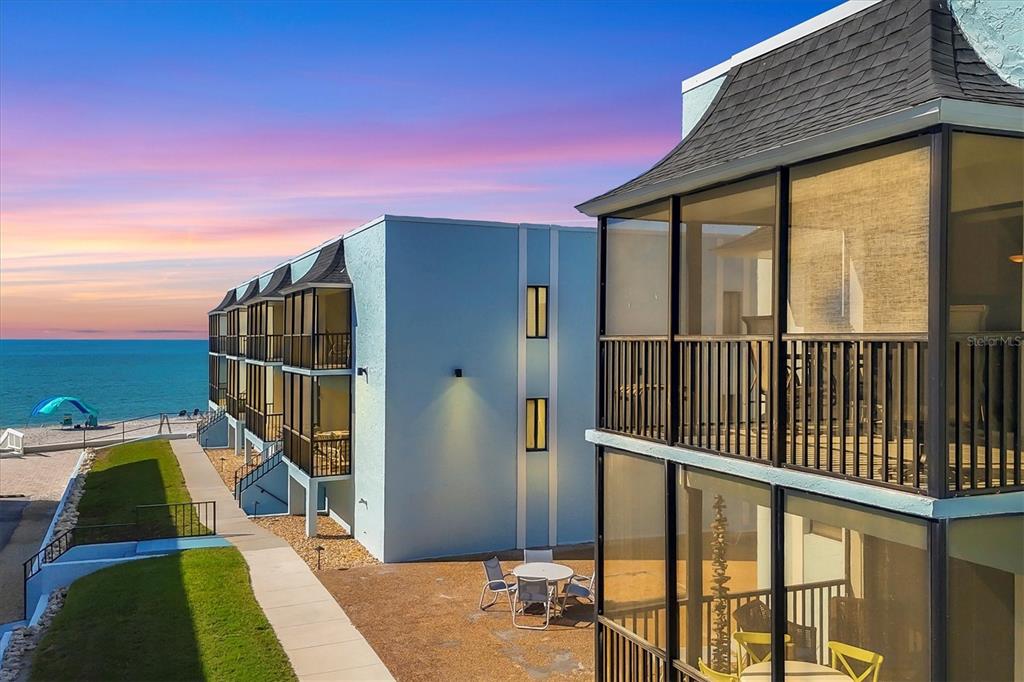a balcony with view of swimming pool