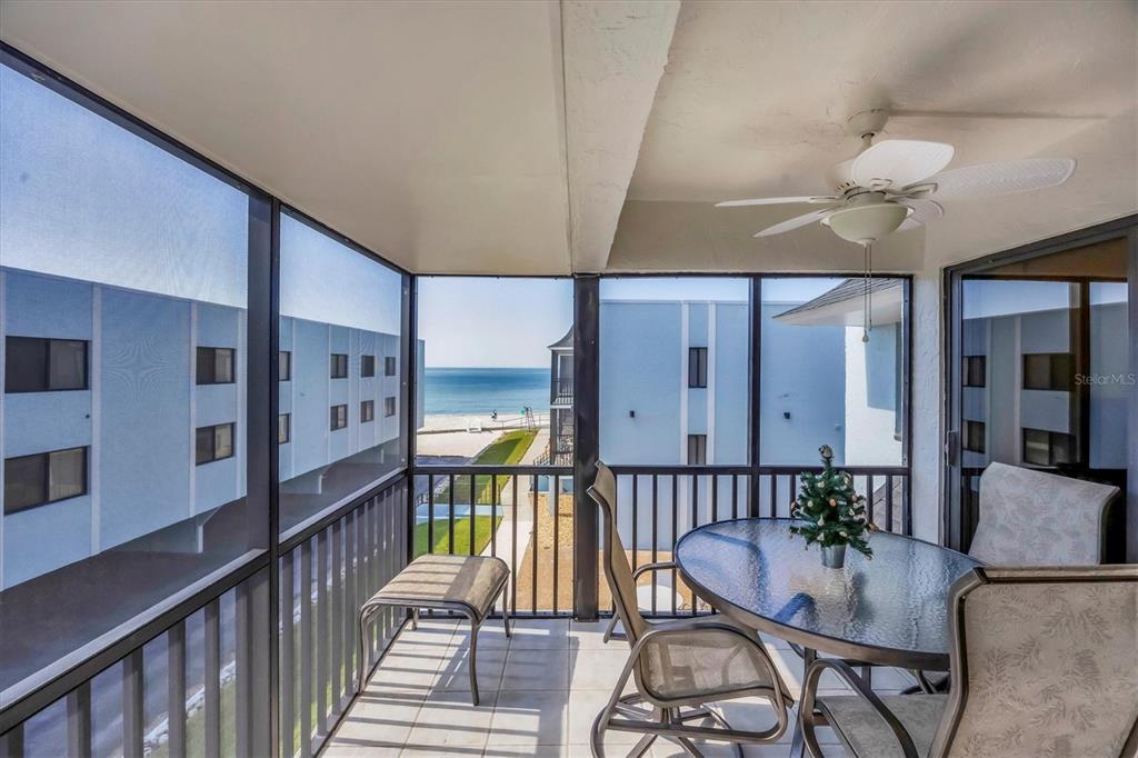 2810 North Beach Road, Unit D205 Englewood, FL 34223 - Photo 16 of 48 a dining room with furniture and wooden floor