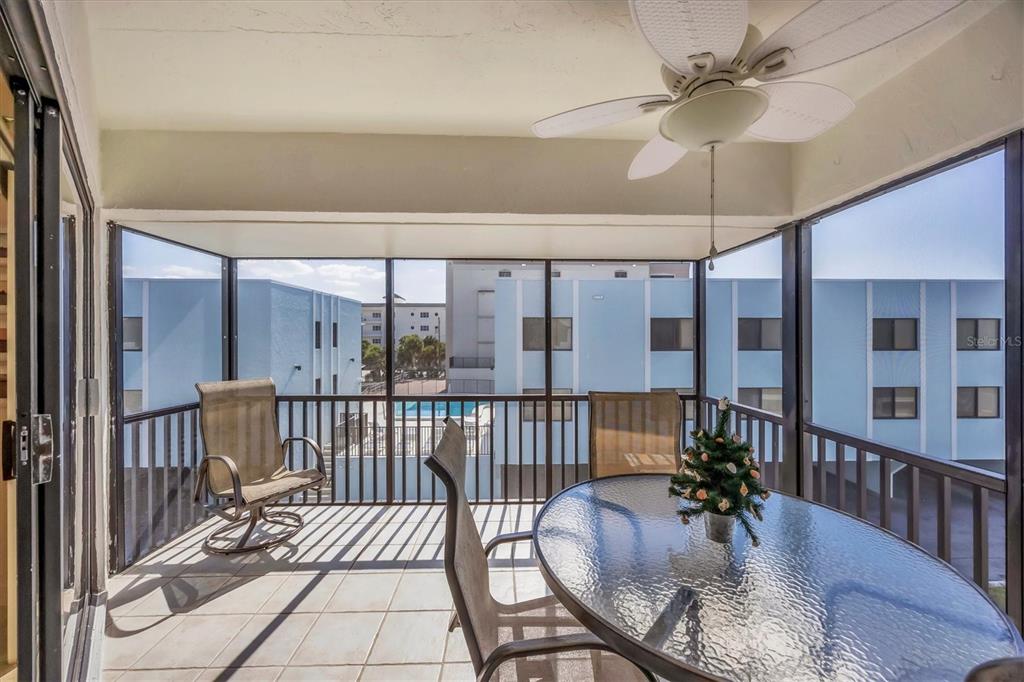 2810 North Beach Road, Unit D205 Englewood, FL 34223 - Photo 18 of 48 a view of a porch with furniture