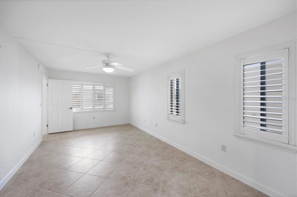 2810 North Beach Road, Unit D205 Englewood, FL 34223 - Photo 22 of 48 a view of an empty room with a window