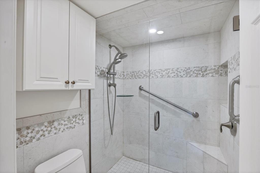 2810 North Beach Road, Unit D205 Englewood, FL 34223 - Photo 25 of 48 a bathroom with a shower and a toilet