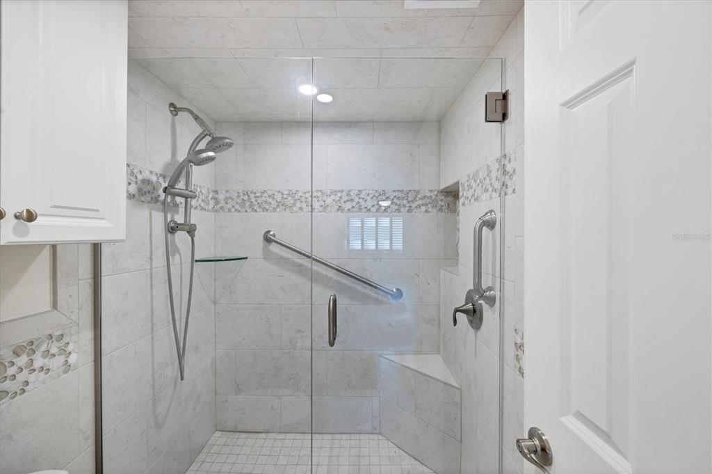 2810 North Beach Road, Unit D205 Englewood, FL 34223 - Photo 26 of 48 a bathroom with a shower