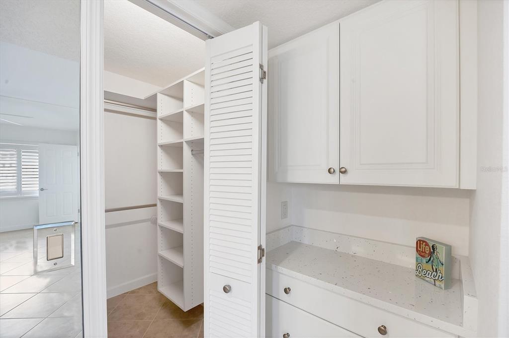 2810 North Beach Road, Unit D205 Englewood, FL 34223 - Photo 27 of 48 a bathroom with a bathtub and cabinets