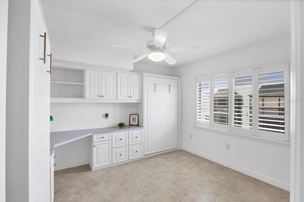 2810 North Beach Road, Unit D205 Englewood, FL 34223 - Photo 29 of 48 a view of cabinets and window