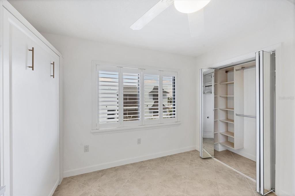 2810 North Beach Road, Unit D205 Englewood, FL 34223 - Photo 32 of 48 a view of an empty room with a window